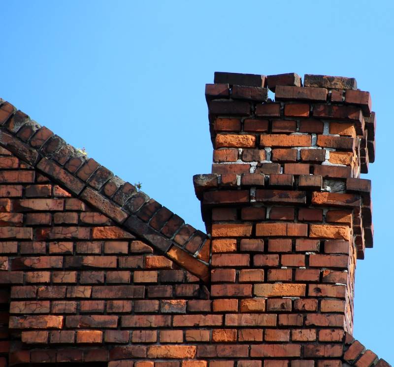 Signs Your Phoenix Home Needs a Chimney Inspection Damaged chimney on an Phoenix home showing cracks and missing mortar